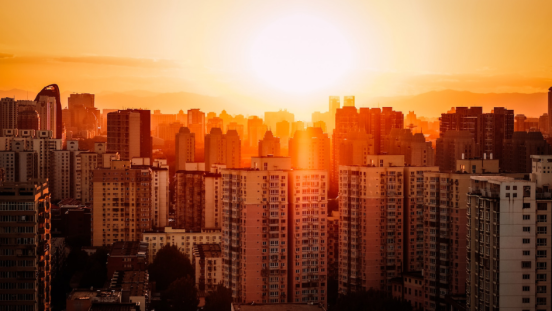 residential neighbourhood in Beijing with the sun casting red glow on buildings